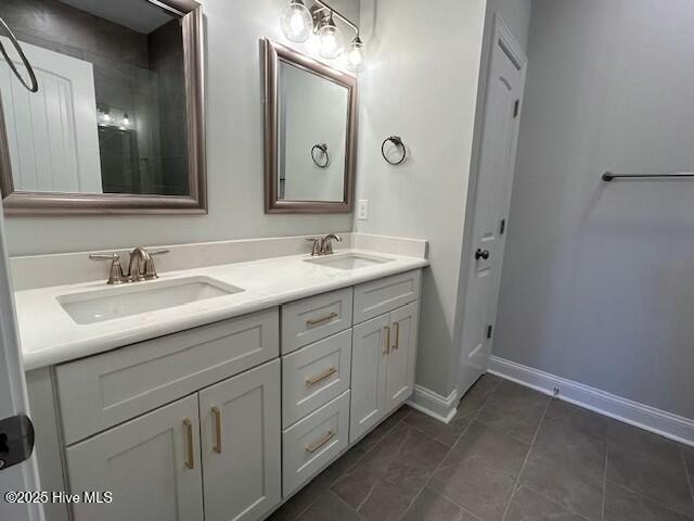 bathroom with tile patterned flooring and vanity