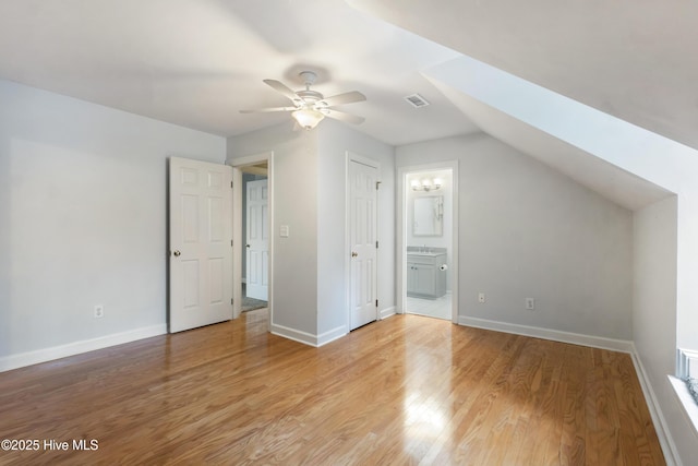 bonus room featuring light hardwood / wood-style flooring, vaulted ceiling, and ceiling fan