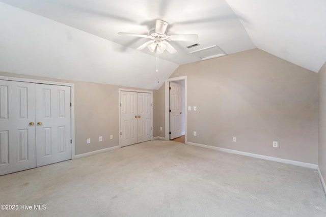 bonus room with light carpet, vaulted ceiling, and ceiling fan