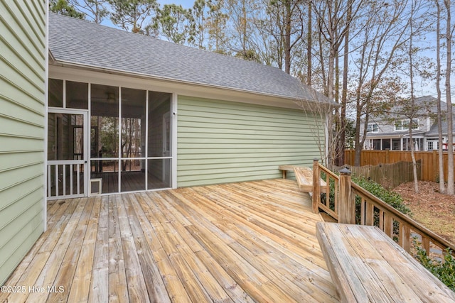 wooden deck with a sunroom