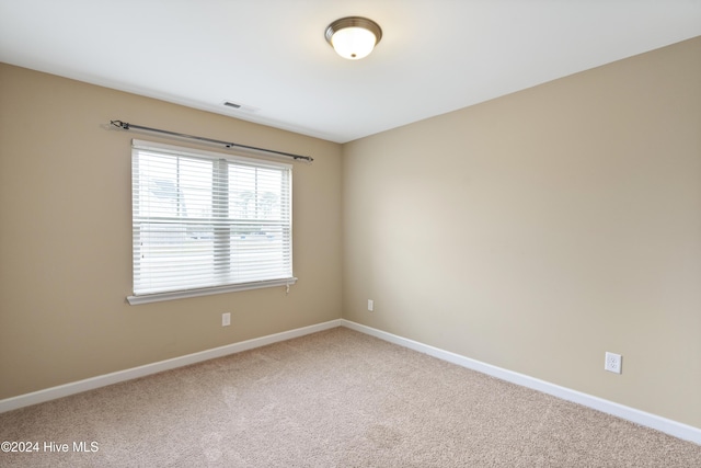 spare room with carpet flooring