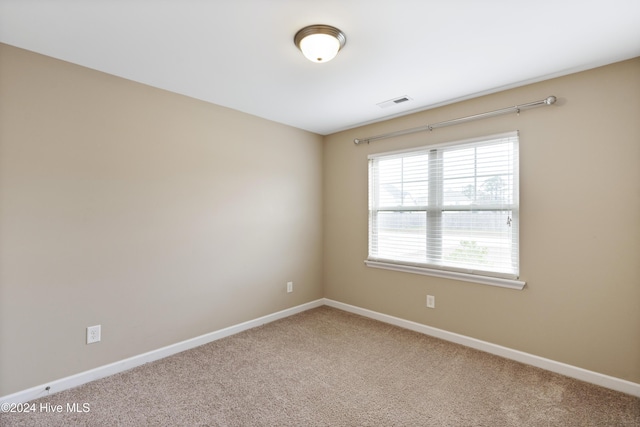 unfurnished room with carpet flooring