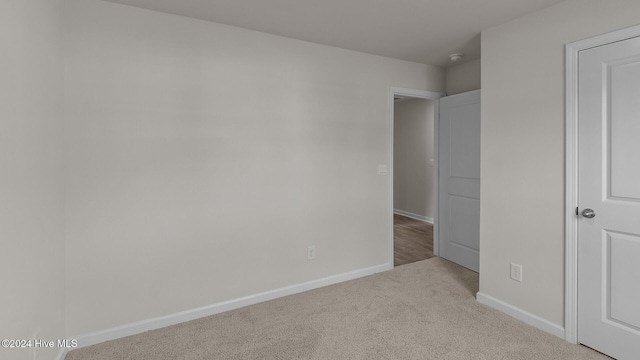 unfurnished bedroom with light colored carpet