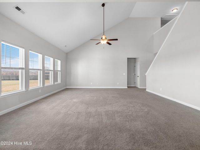 unfurnished living room featuring carpet flooring, high vaulted ceiling, and ceiling fan