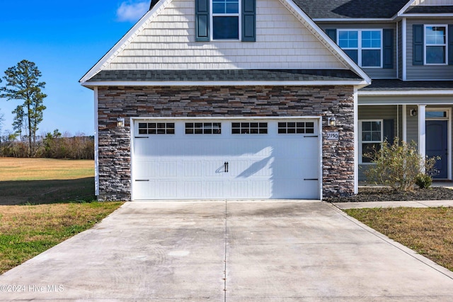 exterior space with a lawn and a garage