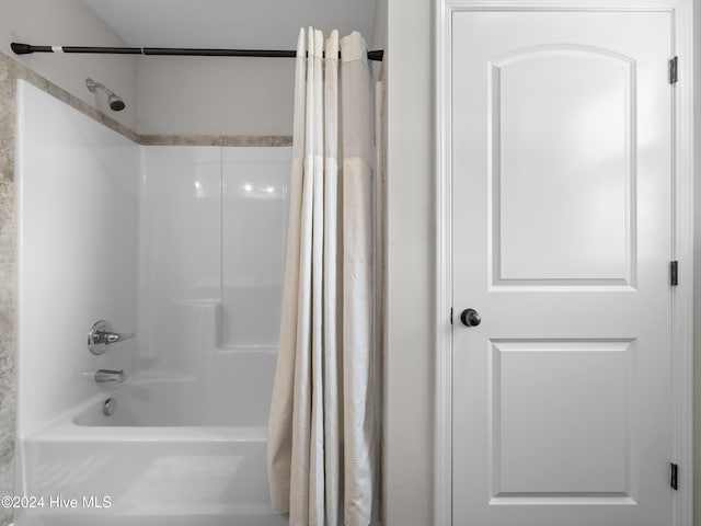 bathroom featuring shower / bath combo with shower curtain