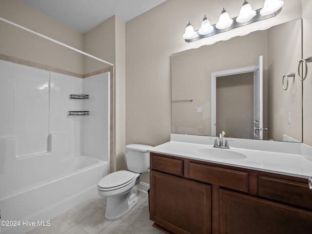 full bathroom featuring tile patterned floors, washtub / shower combination, vanity, and toilet