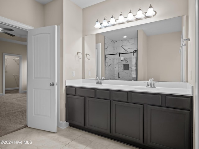 bathroom featuring tile patterned floors, ceiling fan, vanity, and walk in shower