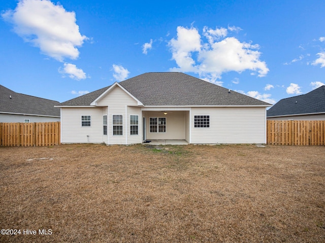 back of property with a patio area