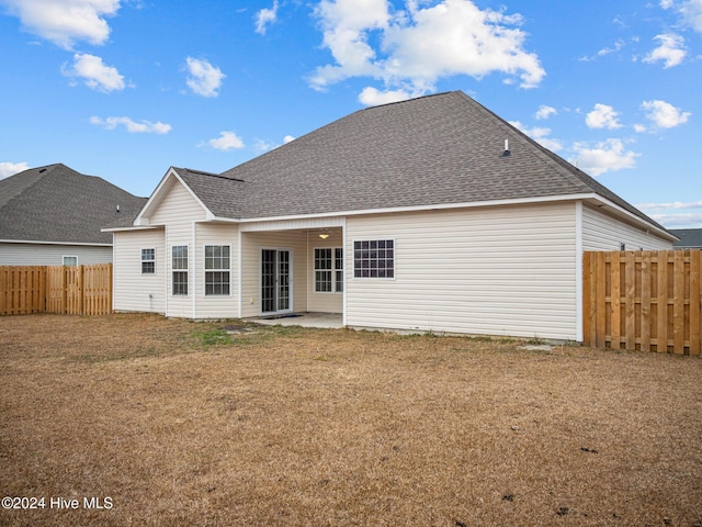 back of property with a patio area