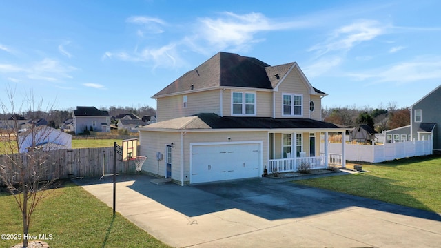 view of front of house with covered porch, a garage, and a front yard