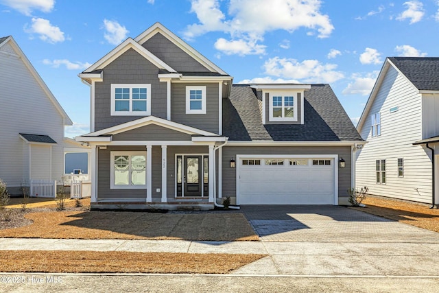 view of front facade featuring a garage and a porch