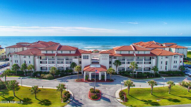 drone / aerial view with a view of the beach and a water view