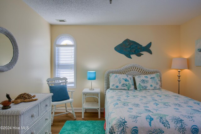 bedroom featuring hardwood / wood-style floors