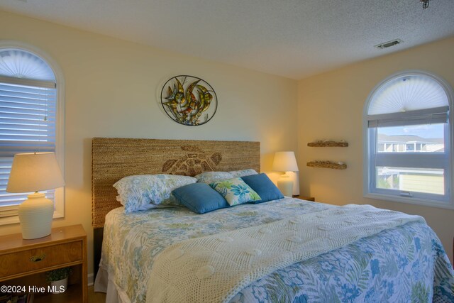 birds eye view of property featuring a view of the beach and a water view