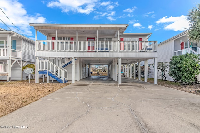 beach home featuring a carport