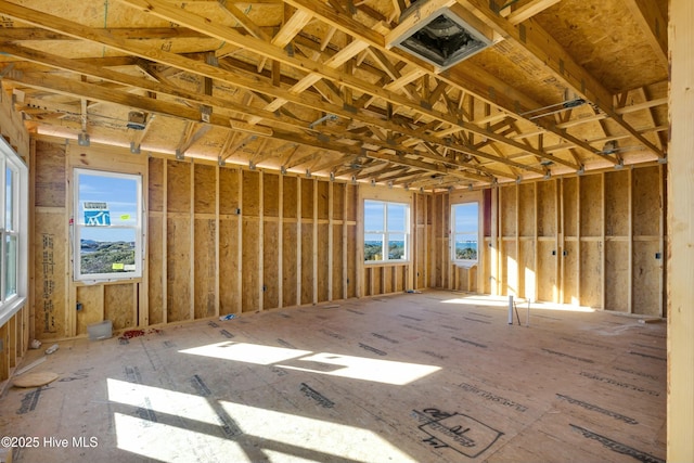 misc room featuring a garage and visible vents