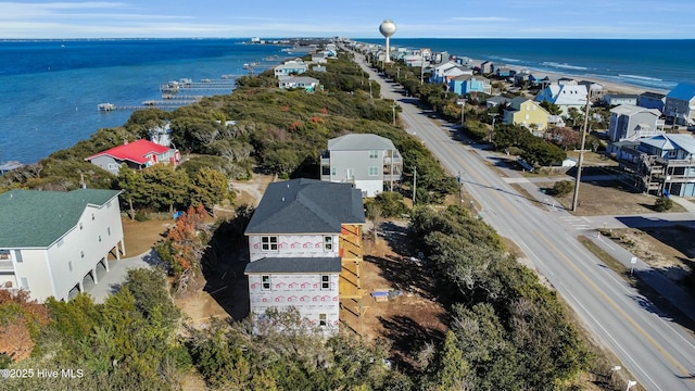 drone / aerial view featuring a residential view and a water view