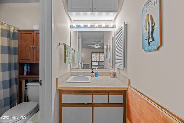 bathroom with ceiling fan, vanity, and toilet