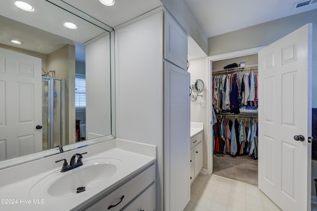 bathroom featuring vanity and walk in shower