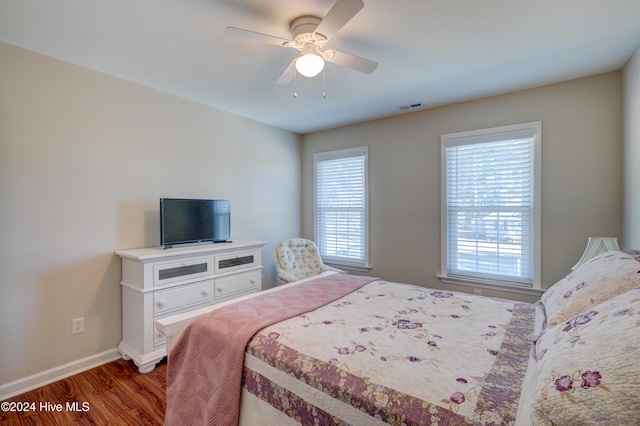 bedroom featuring wood-type flooring and ceiling fan