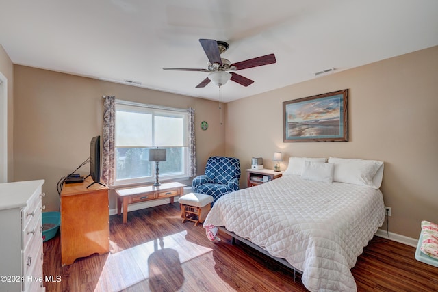 bedroom featuring ceiling fan and dark wood-type flooring