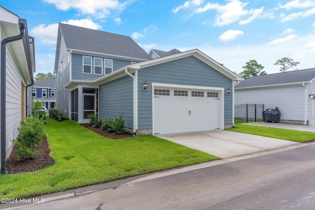 view of front of home featuring a garage and a front lawn