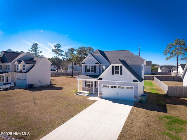 view of front facade with a garage and a front yard