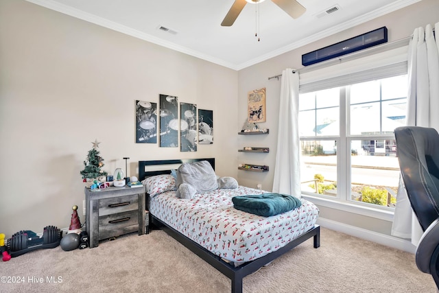 bedroom featuring carpet flooring, ceiling fan, and crown molding