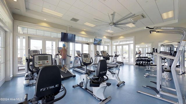 gym featuring ceiling fan and french doors