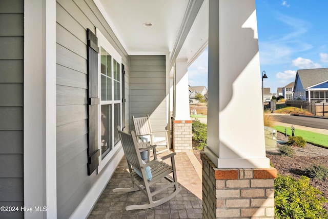 view of patio featuring a porch