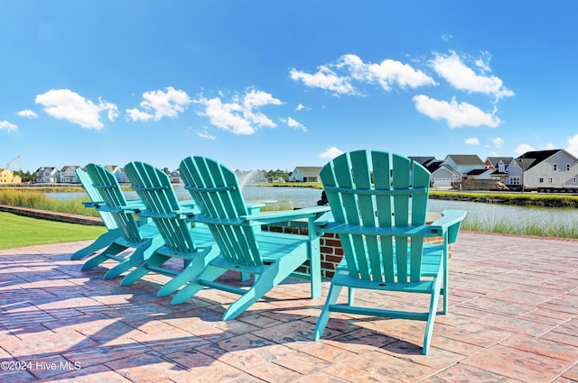 view of patio with a water view