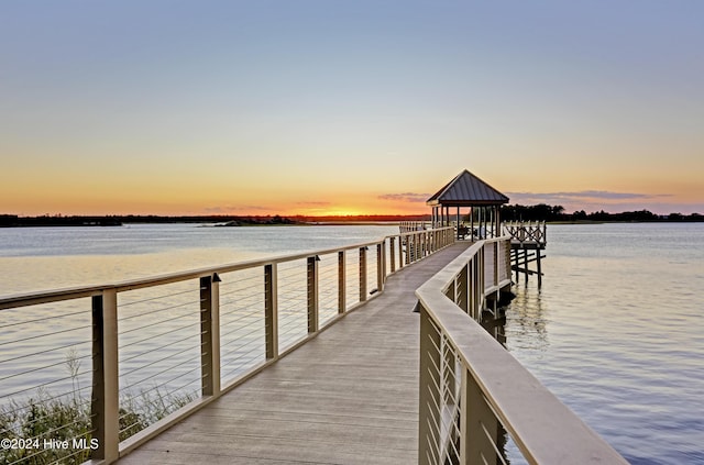 dock area featuring a gazebo and a water view