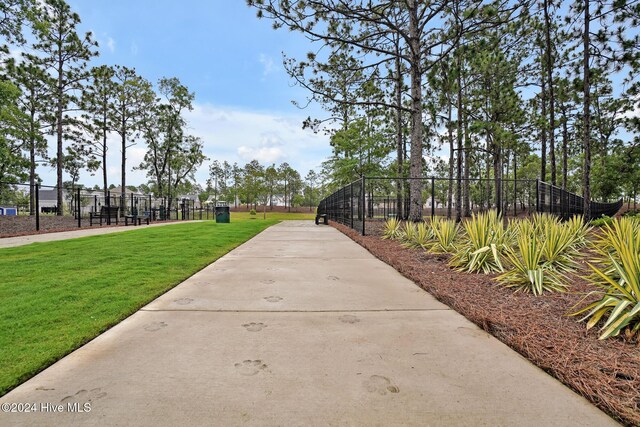 surrounding community featuring a yard