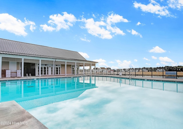 view of swimming pool featuring a patio