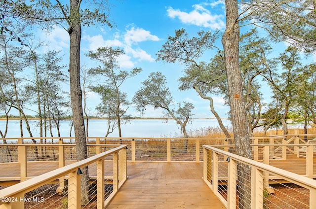 wooden deck with a water view