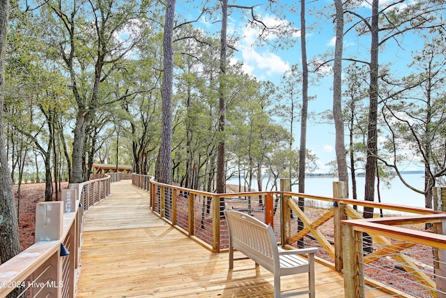 wooden deck with a water view