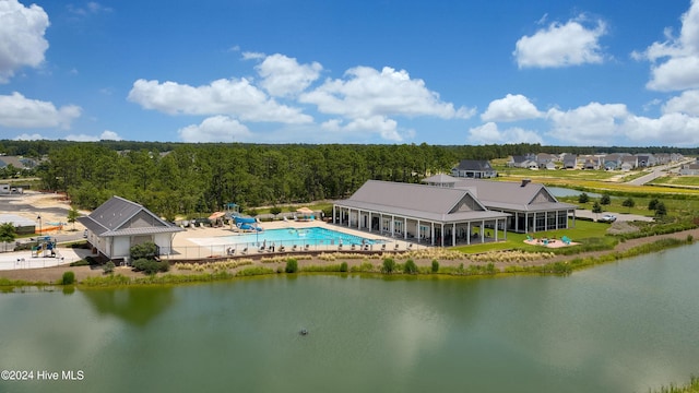 birds eye view of property with a water view