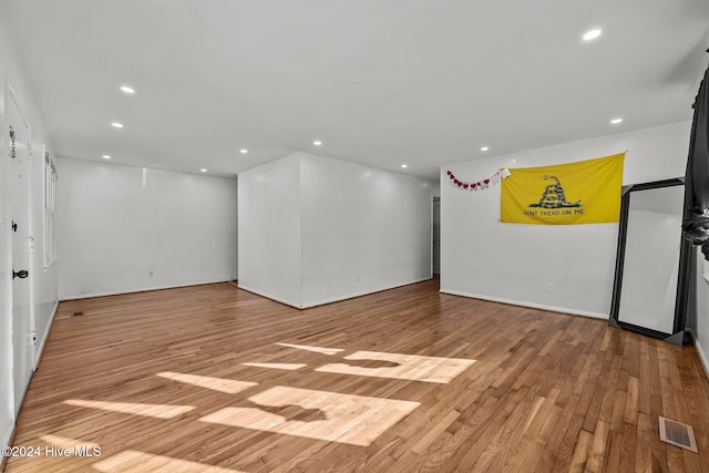 spare room with light hardwood / wood-style flooring