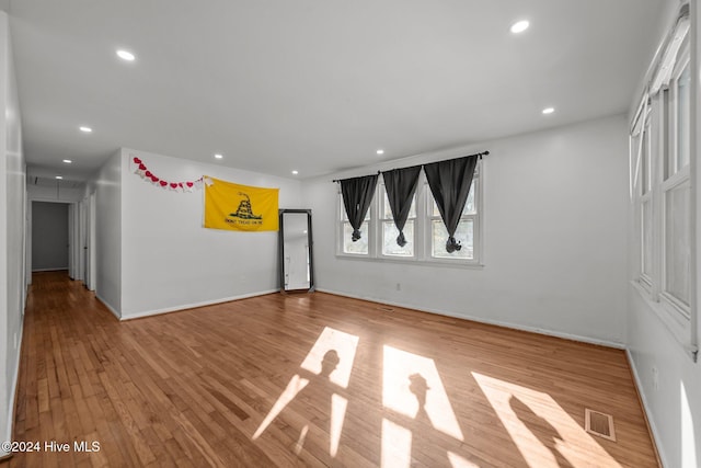 spare room featuring hardwood / wood-style floors