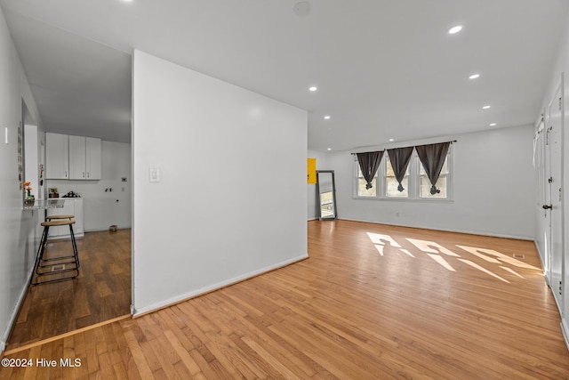 unfurnished living room featuring light wood-type flooring