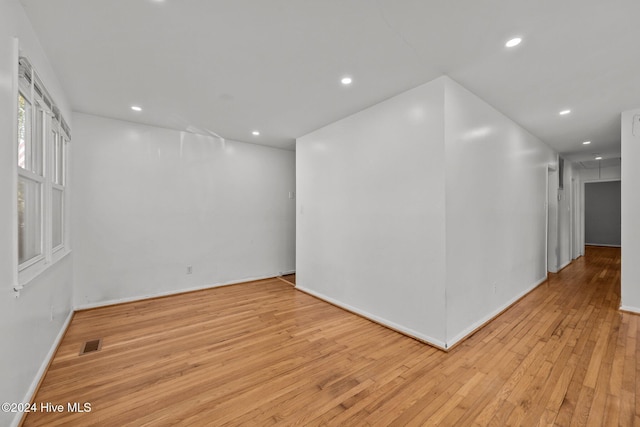 unfurnished room with light hardwood / wood-style flooring