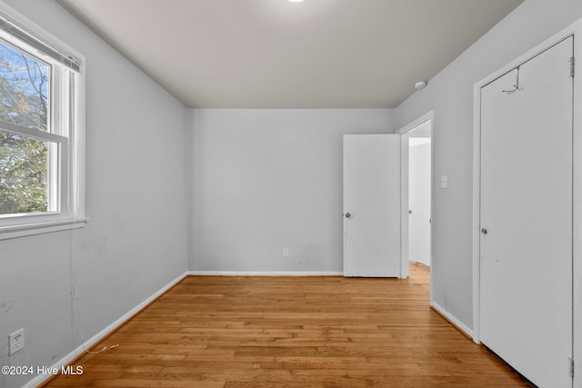 empty room featuring light hardwood / wood-style floors and a wealth of natural light