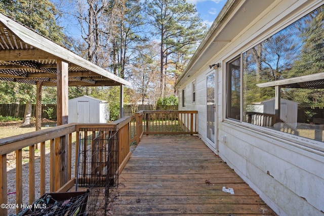 wooden deck with a storage shed