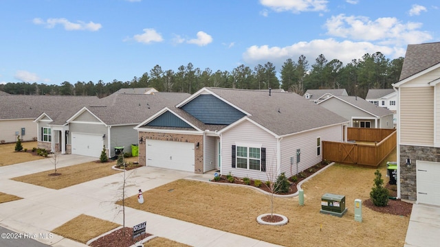 view of front of house featuring a garage and a front yard