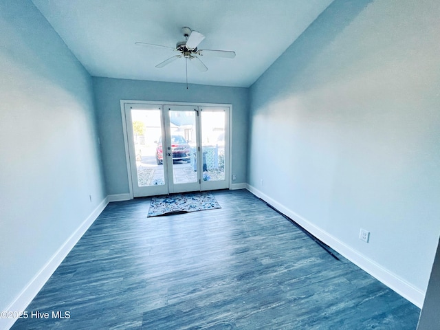 spare room with dark wood-type flooring, ceiling fan, and french doors