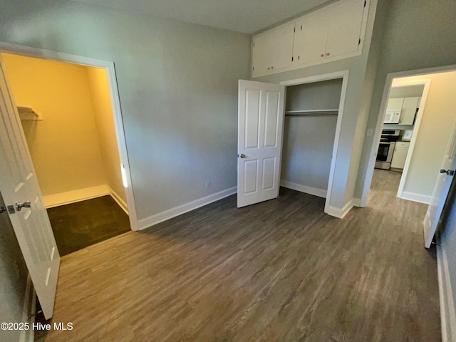 unfurnished bedroom featuring hardwood / wood-style flooring and a closet