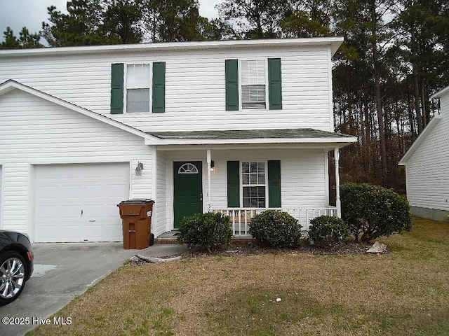 view of front property featuring a porch, a garage, and a front yard