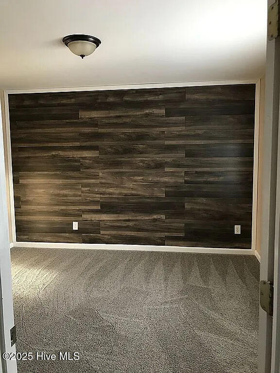 empty room with wooden walls