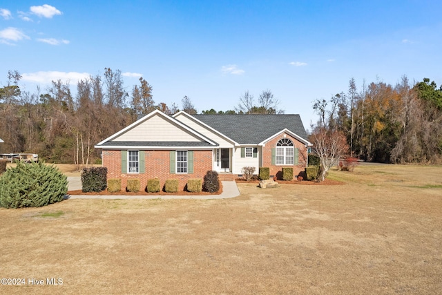 single story home featuring a front yard